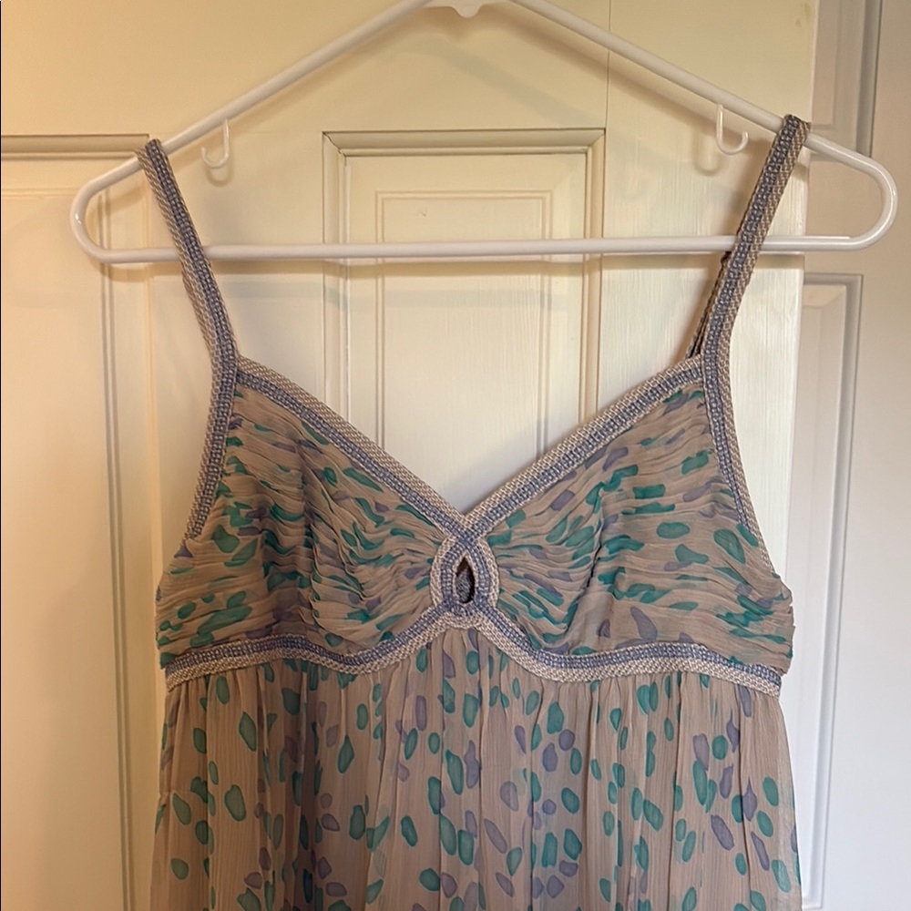 Elegant Sleeveless Dress with Teal and Purple Accents